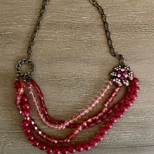 Pink layered beaded necklace with flower brooch